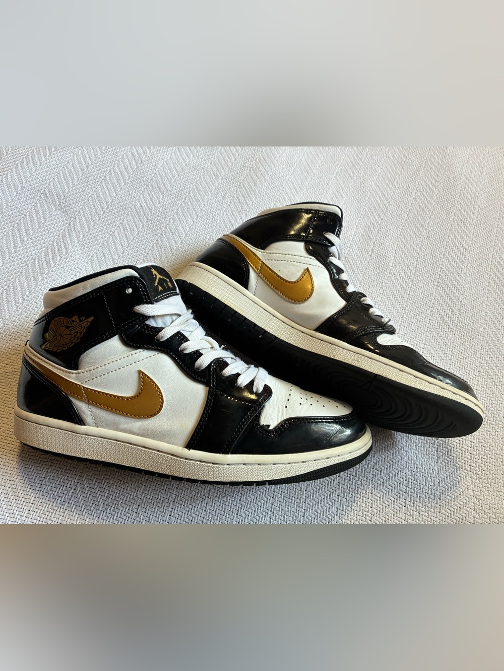 Jordan White Black Sneakers with Gold Accent